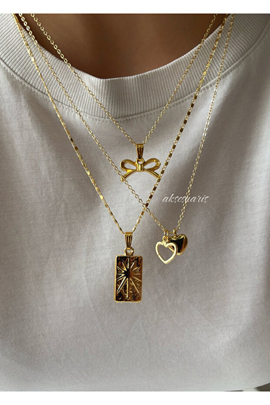 Ensemble de colliers pour femmes Aksesuaris avec 3 pendentifs ruban dorés