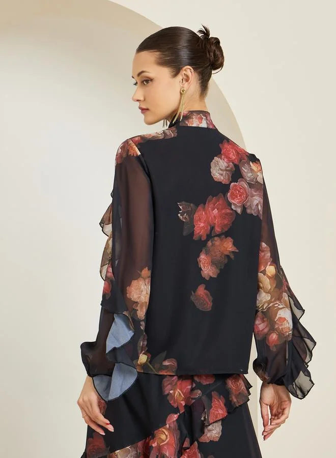Chemisier noir à imprimé floral et manches à volants