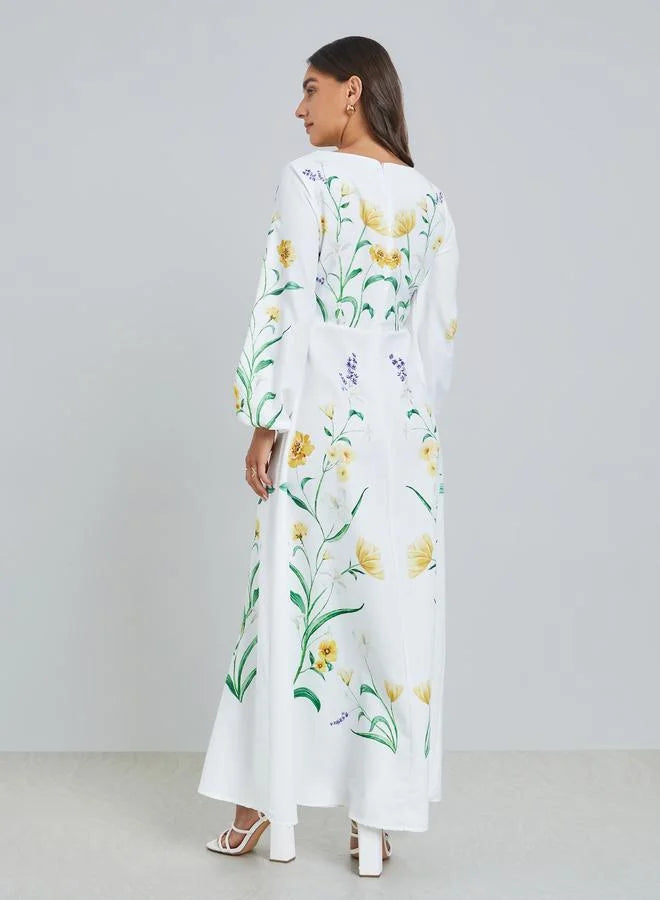Robe longue blanche à imprimé floral et manches bouffantes