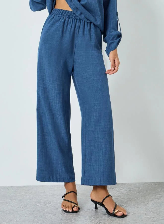 Ensemble haut à col en V uni et pantalon à taille élastique pour femme