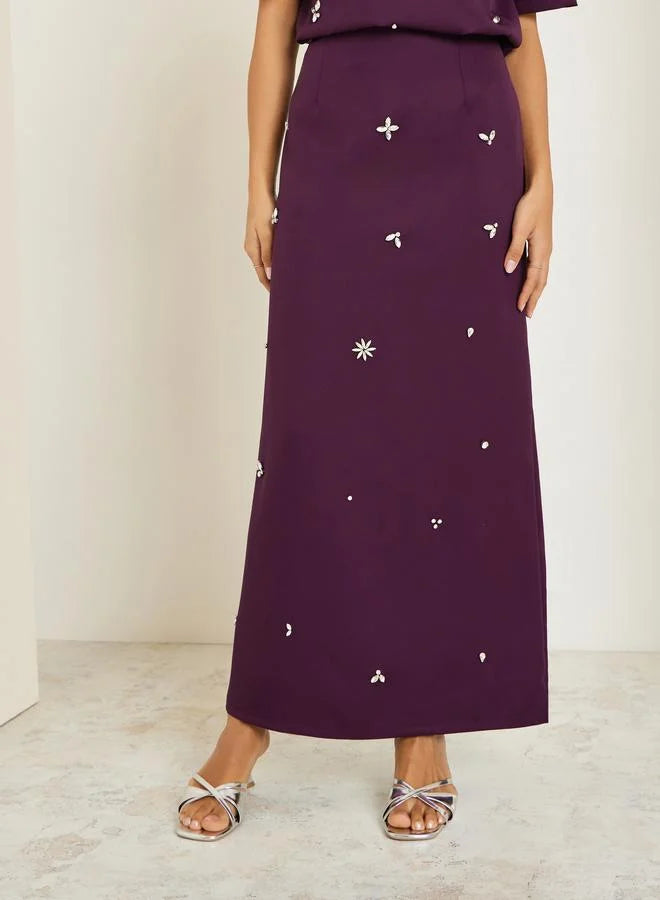 Ensemble jupe et haut violet orné pour femme