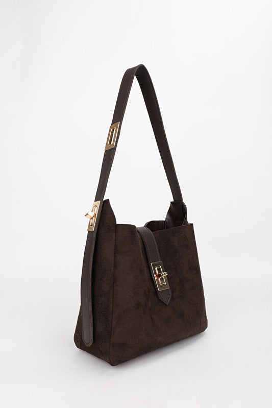 Sac à main NOTHING  pour femme, bordeaux et or, avec bandoulière ajustable et fermoir décoratif. Convient pour un porté main, épaule ou bras.