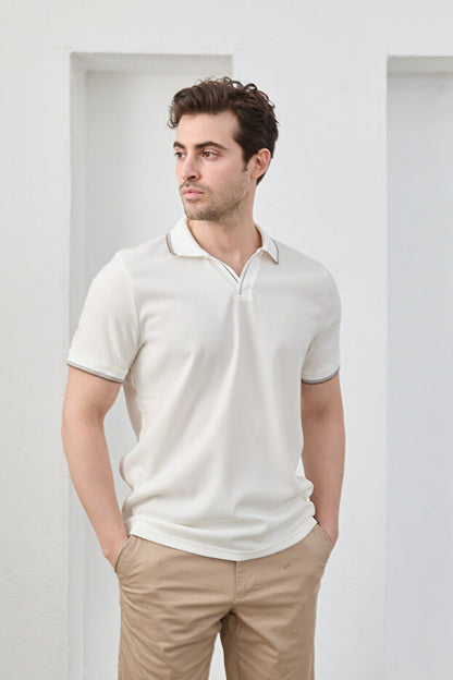 T-shirt homme RAVANELLI  , tissu en coton infroissable, coupe ajustée, col polo