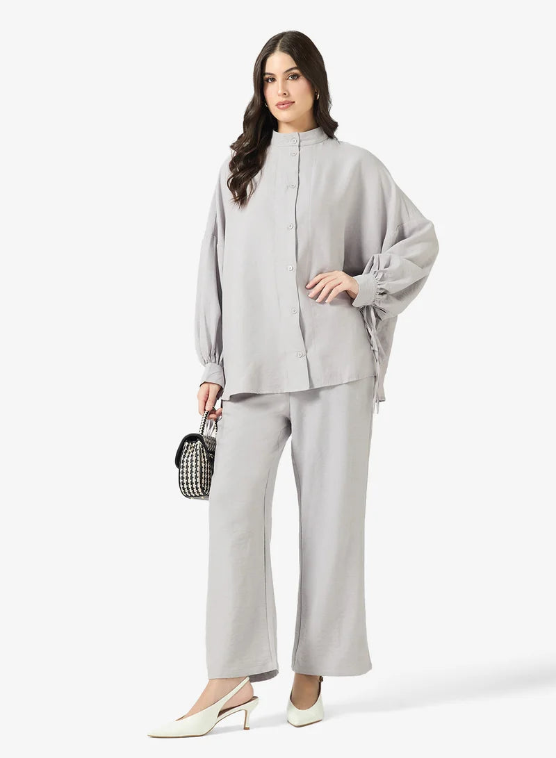 Ensemble chemise et pantalon à boutons longs