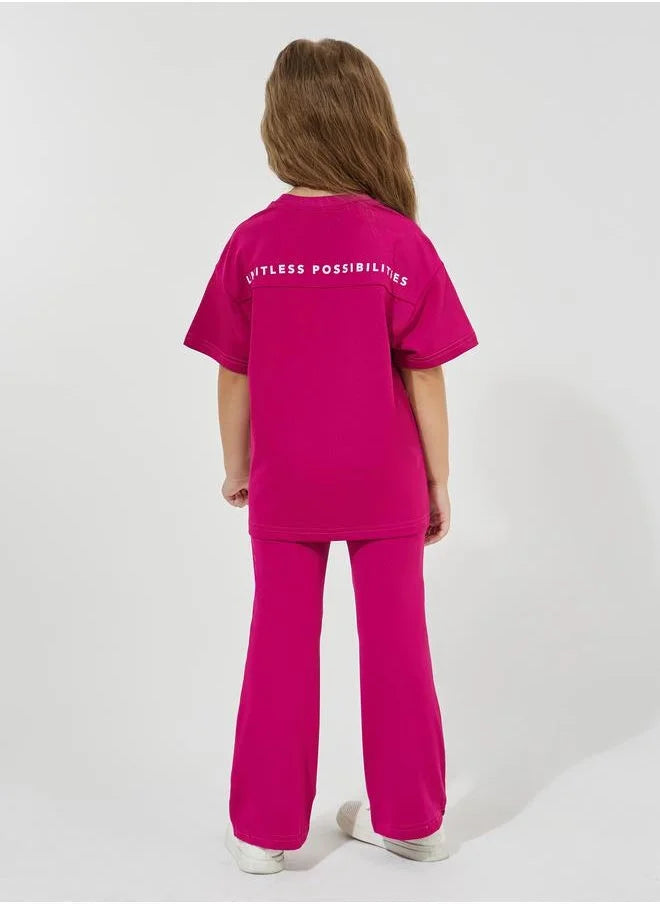 Ensemble t-shirt oversize à imprimé slogan et pantalon évasé