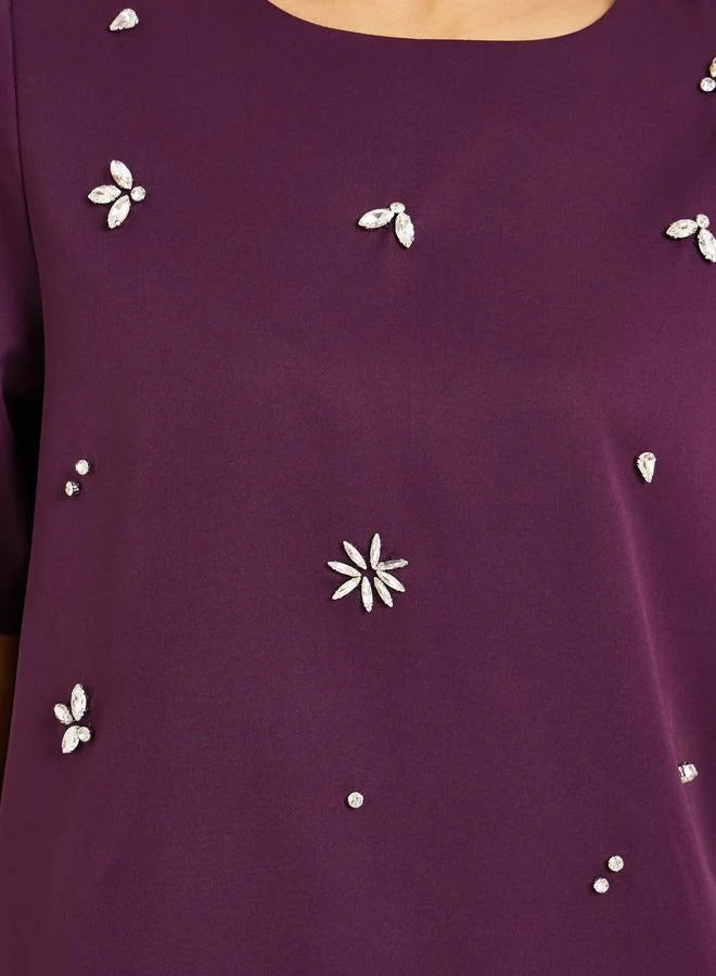 Ensemble jupe et haut violet orné pour femme
