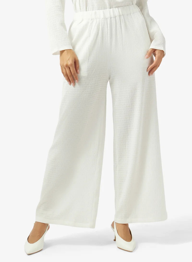 Ensemble haut cache-cœur et pantalon