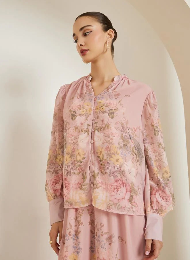 Chemisier rose clair à imprimé floral placé