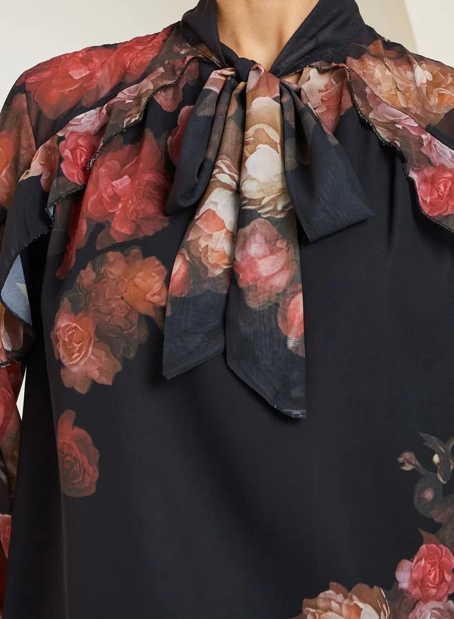 Chemisier noir à imprimé floral et manches à volants