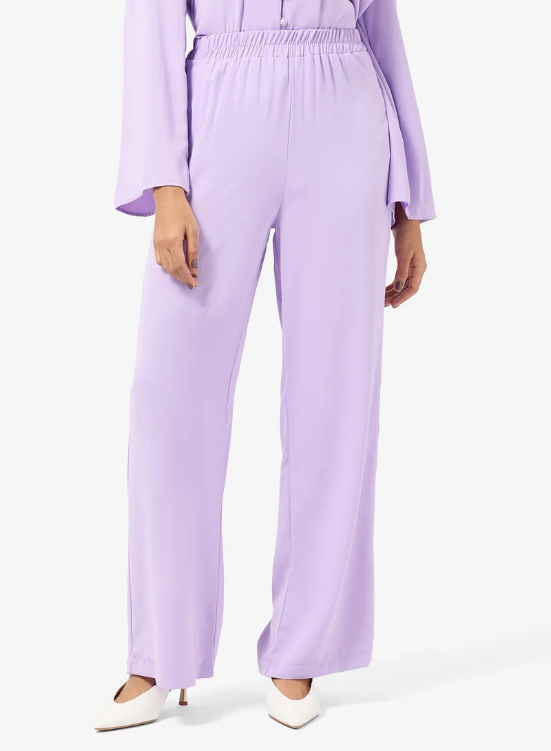 Ensemble tunique et pantalon à boutons