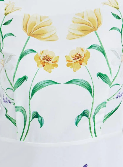 Robe longue blanche à imprimé floral et manches bouffantes