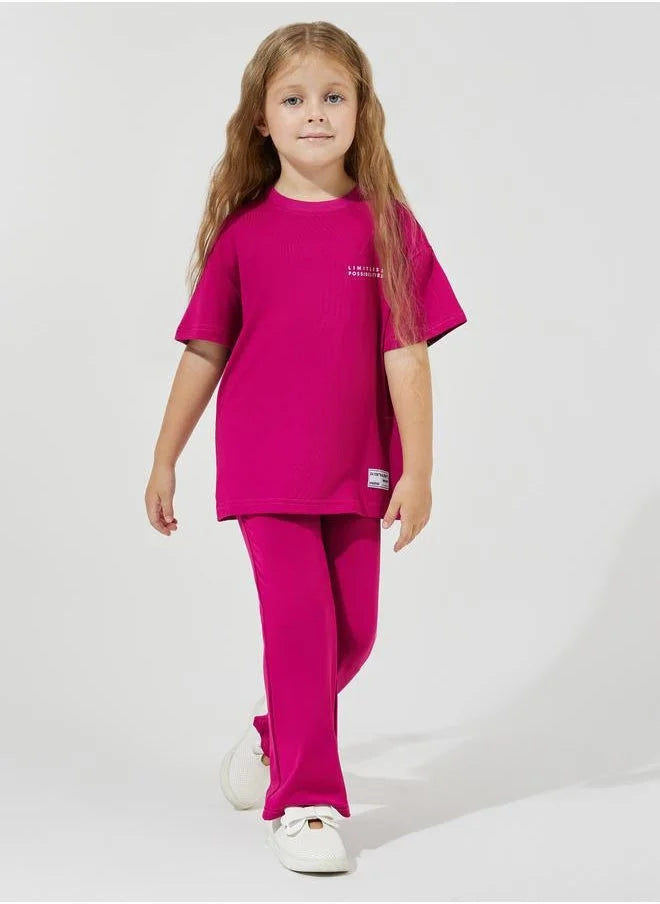 Ensemble t-shirt oversize à imprimé slogan et pantalon évasé