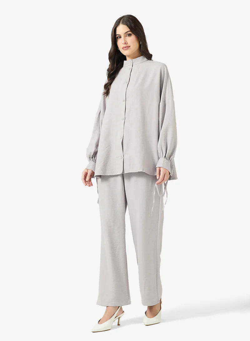 Ensemble chemise et pantalon à boutons longs