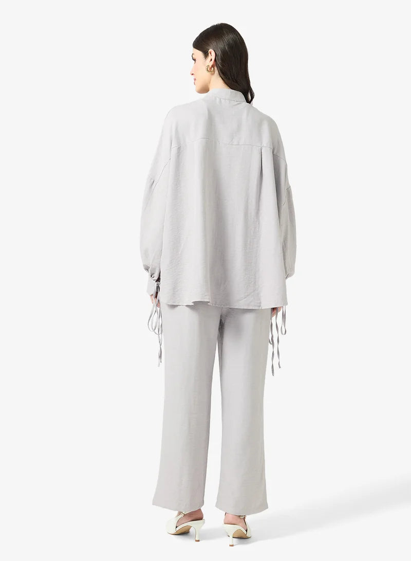 Ensemble chemise et pantalon à boutons longs
